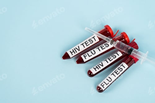 Preview: top view of syringe on samples with hiv test and flu test lettering on blue