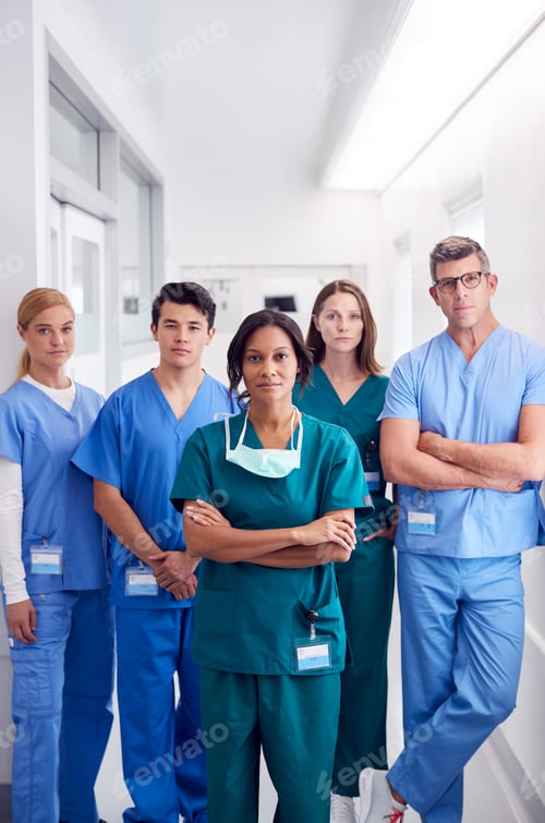 Preview: Portrait Of Multi-Cultural Medical Team Standing In Hospital Corridor