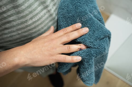 Preview: Anonymous Man Drying Injured Finger with Stitches.