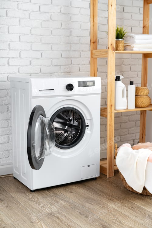 Preview: Laundry room with washing machine and basket with laundry