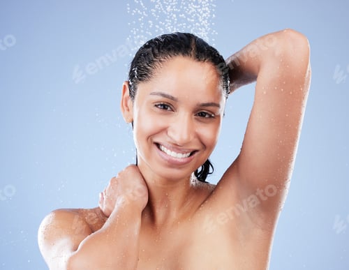 Preview: Shot of a young woman taking a shower against a blue background