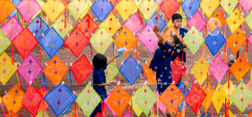 Preview: Asian girl jump to play with bubble that create from bubble gun and happy playing with friends