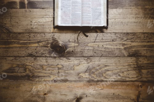 Preview: Overhead shot of an open book on a wooden surface