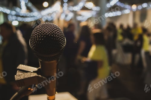 Preview: Closeup shot of a microphone on blurred background
