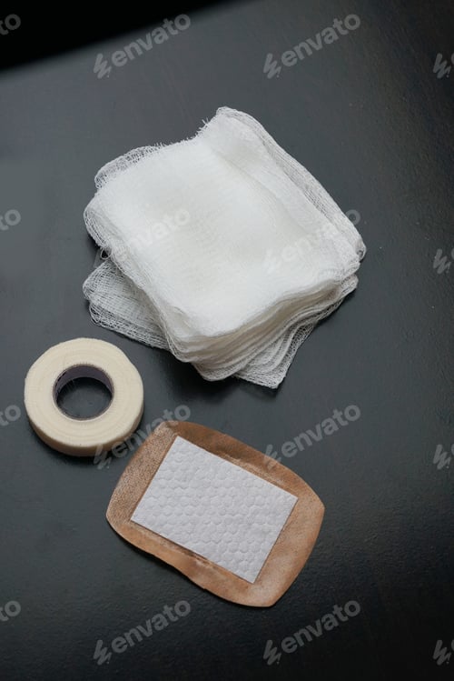 Preview: Gauze pads bandage and scissors used to control bleeding for first aid