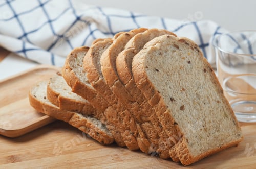 Preview: Sliced whole wheat bread on the wooden board