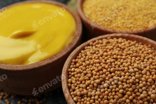Preview: Wooden bowls with mustard seeds, sauce and powder, close up