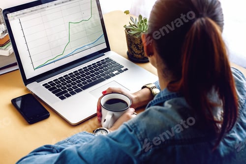 Preview: stylish young girl holding cup of coffee with laptop and phone