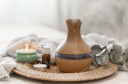 Preview: Spa composition with aroma oil diffuser lamp on a blurred background.