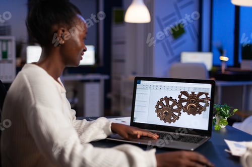 Preview: African american architect working industrial new project working at gear prototype