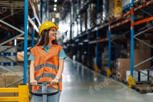 Preview: Female warehouse worker driving forklift through warehouse