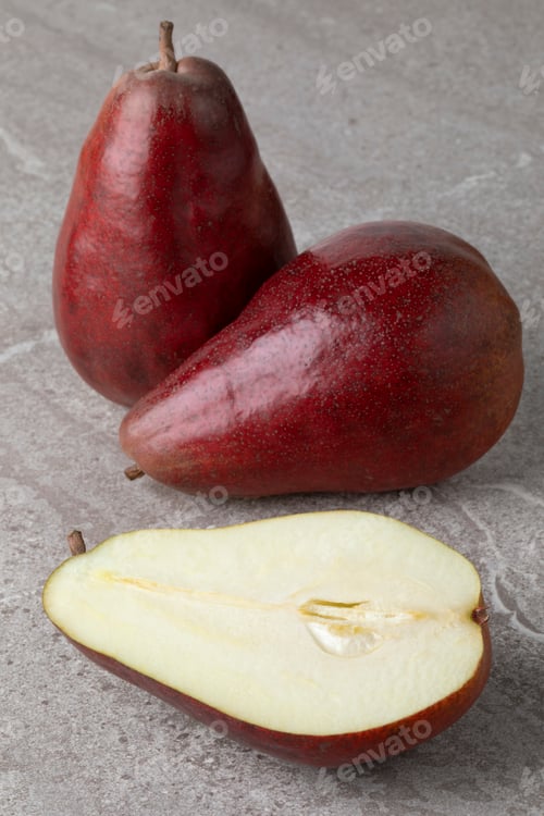 Preview: Whole and half fresh ripe Red Modoc pears