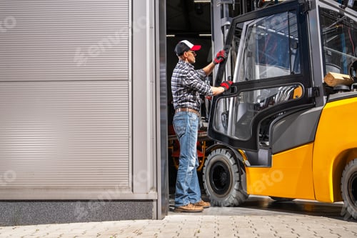 Preview: Forklift Driver Loading Fork Truck Into Warehouse