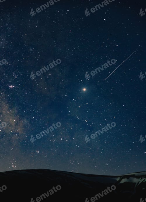 Preview: A beautiful shot of an amazing sky full of breathtaking stars at night over the hills