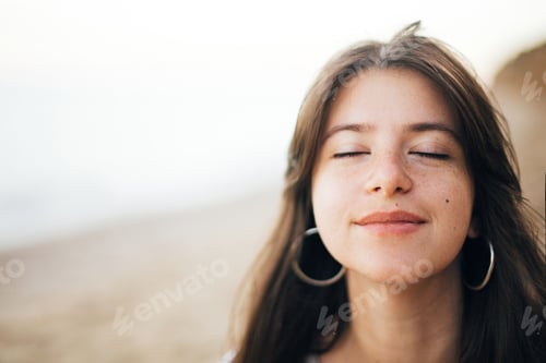 Preview: Stylish hipster girl walking on beach at sea