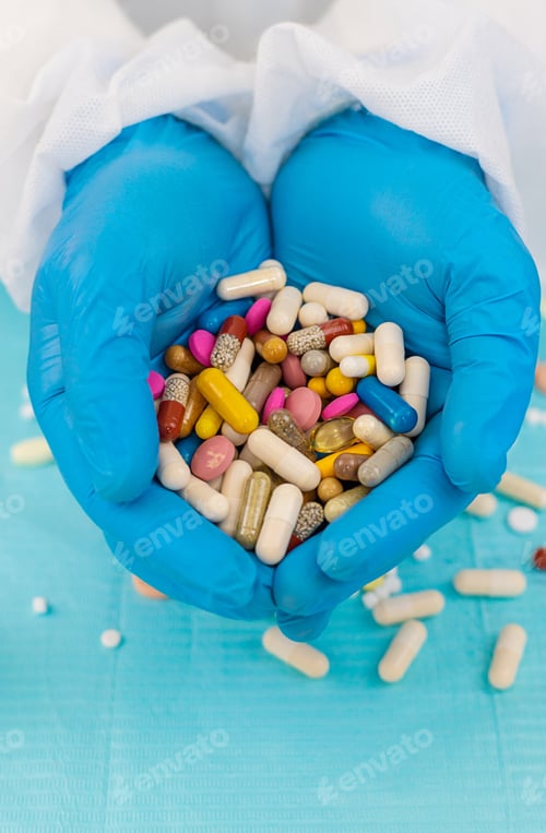 Preview: medicines in the hands of a doctor. Selective focus.
