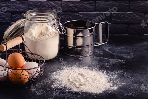 Preview: Table with baking products and tools.
