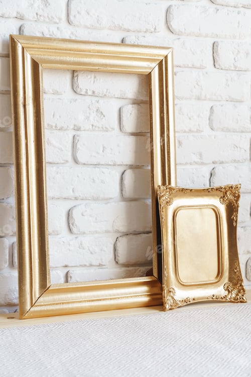 Preview: Photo frames on floor over white brick wall