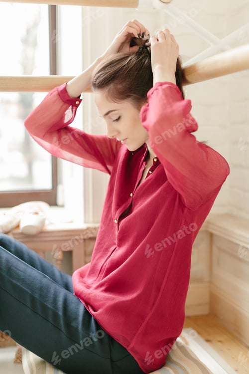 Preview: Girl student in casual outfit reading book, studying in sunny ballet dance room