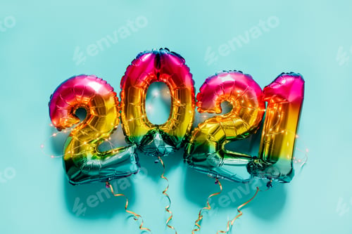 Preview: Rainbow colored Foil balloons in the form of numbers 2021 on blue background