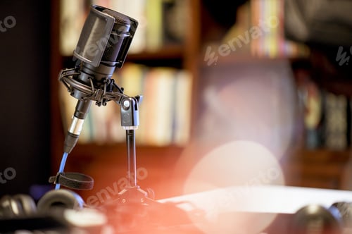 Preview: Microphone in a studio surrounded by equipment under the lights with a blurry background