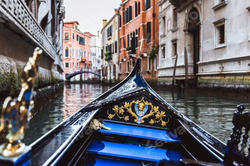 Preview: Traditional gondola on narrow canal in Venice, Italy