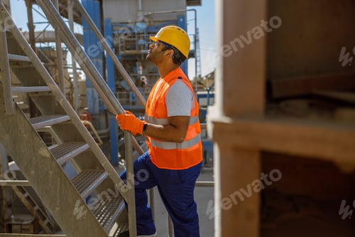 Preview: Experienced engineer working hard at concrete plant
