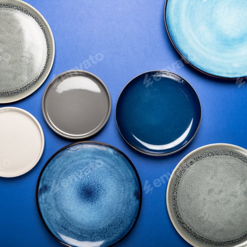 Preview: Empty Blue Plates on Grey Background