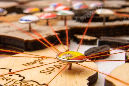 Preview: Spain flag pins and red thread for traveling and planning trip.