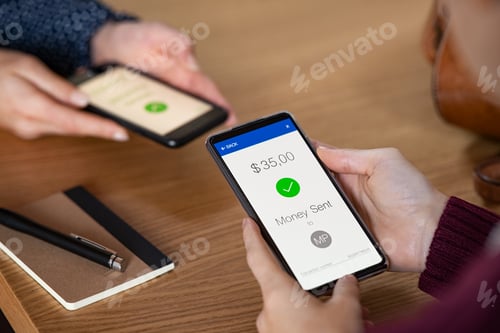 Preview: Woman sending money with phone