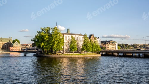 Preview: Lush green island with historic buildings and bridges in Stockholm