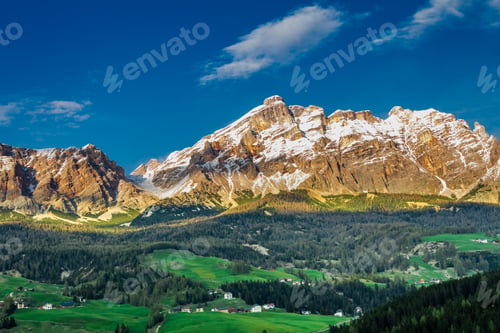 Preview: Sunset over small town in Dolomites, Italy