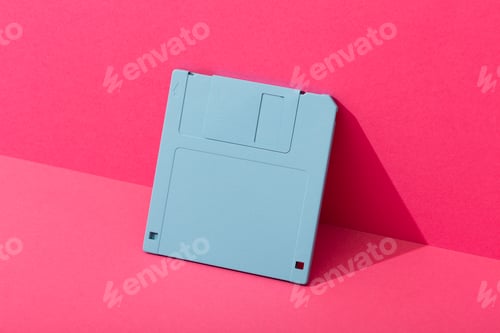 Preview: Blue floppy disk on a pink background.