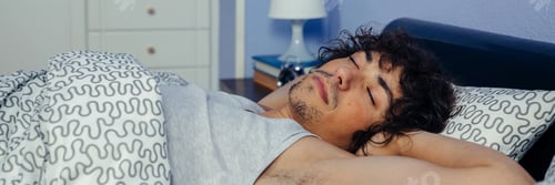 Preview: Man sleeping in bed at home