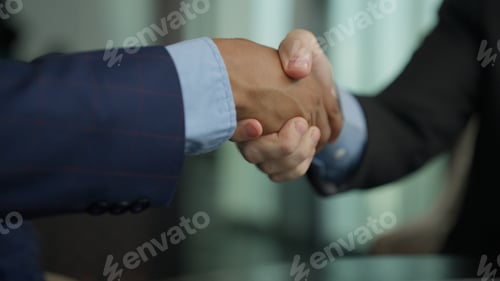Preview: Business people shacking hands together showing successful contract agreement