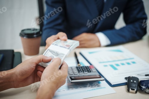 Preview: businessman holds the key to success in car finance, focusing on sales, insurance, and investment