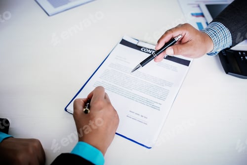 Preview: Close up. Businessman is signing a contract.