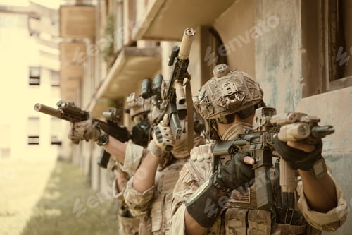 Preview: Professional marine soldiers training with weapon on a military range.