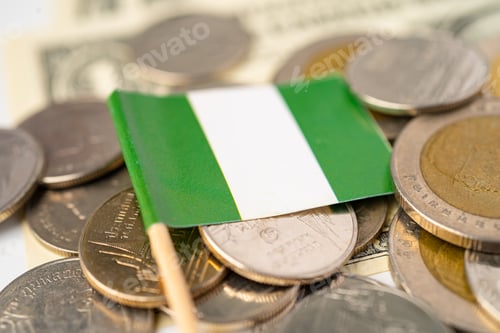 Preview: Stack of coins with Nigeria flag on white background.