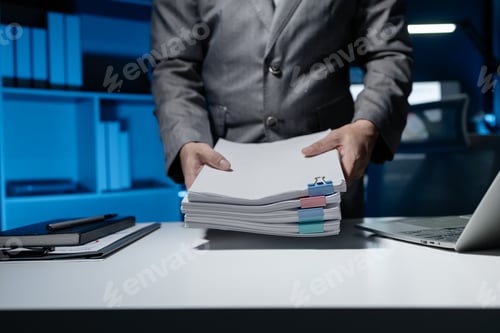 Preview: An employee held a large pile of documents in his hand, Large piles of work documents on desks are b