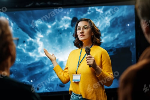 Preview: woman is giving a presentation at conference