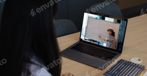Preview: Asian young girl student learning virtual internet online class from school teacher by remote