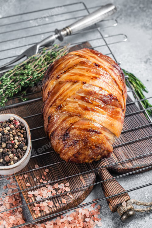 Preview: Baked meatloaf with bacon, meat loaf on a grill. Gray background. Top view