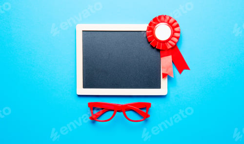Preview: prize ribbon, glasses and blackboard