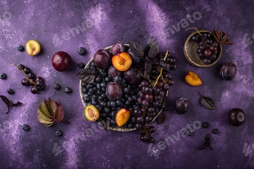 Preview: Assortment of purple fruit plum, grape, blueberry and basil