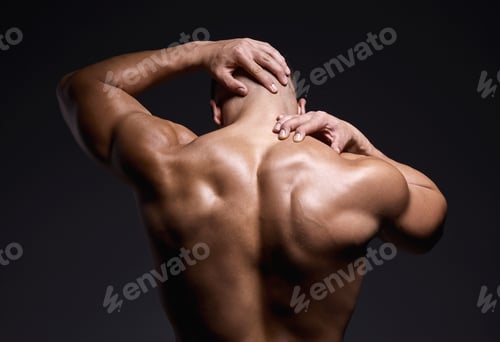 Preview: Id never turn my back on a workout. Shot of a muscular young man posing against a black background.