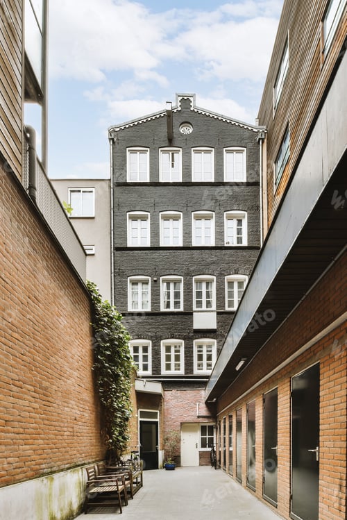 Preview: The facade of a brick building with wooden door