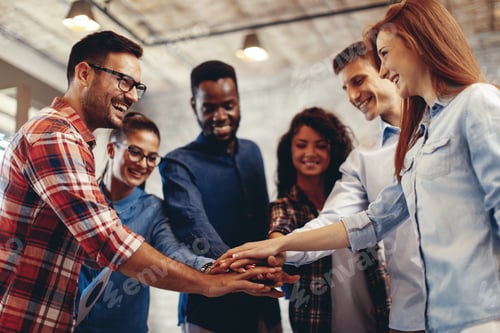 Preview: Young people showing team spirit focus on hands
