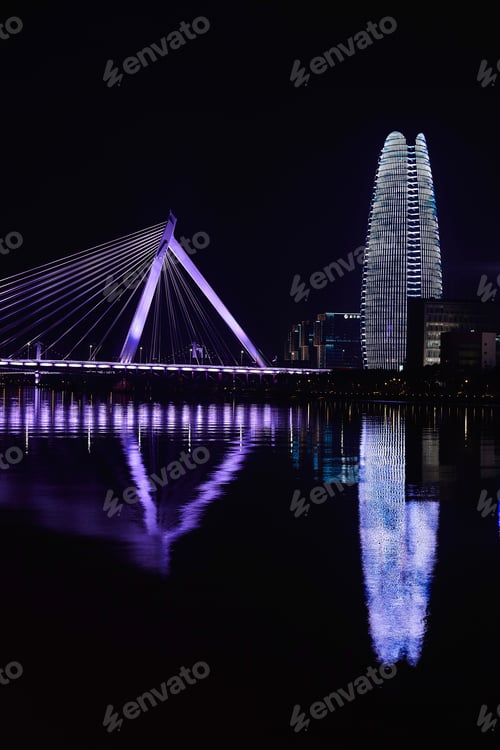 Preview: Floodlit bridge and skyscraper over river at night, Ningbo, Zhejiang, China