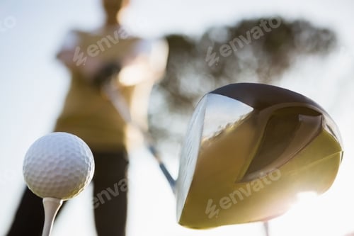 Preview: Focus on foreground of golf club and ball